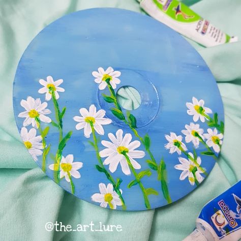 White flowers with green stems in an open blue sky Record Decorations, Cd Wall Art, Cd Wall, Cd Painting, Monogram Tattoo, Cd Art, Diy Home Crafts, Diy Canvas, Light Painting