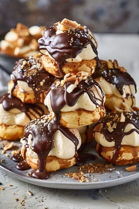 Profiteroles are elegant and delicious cream-filled pastries that are perfect for any occasion! 🥐🍰 Made with light and airy choux pastry, filled with luscious cream, and often topped with a rich chocolate glaze, these treats are a delightful blend of sweet and creamy textures. Easy to make and always a hit, Profiteroles are perfect for special celebrations or a luxurious dessert. Indulge in these classic French pastries today! 😋✨ #Profiteroles #FrenchPastry #ElegantDesserts #SweetTreats Buttered Noodles Recipe, Chicken Pie Recipe, Pastry Cream Filling, Delicious Seafood Recipes, Buttered Noodles, Choux Pastry, Elegant Desserts, Delicious Cream, Halal Recipes