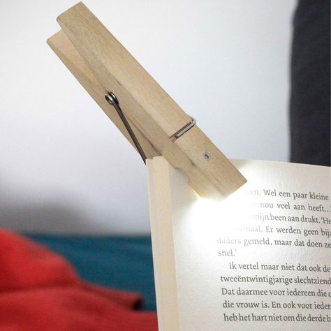 The clothespin reading light is a clip that you can attach to your book and will act as a reading light to help you read in the dark. Clip Lights, Light Clips, Clothes Pin Crafts, Gadgets And Gizmos, Reading Material, Reading Lamp, Book Lights, Reading Light, Travel Gifts