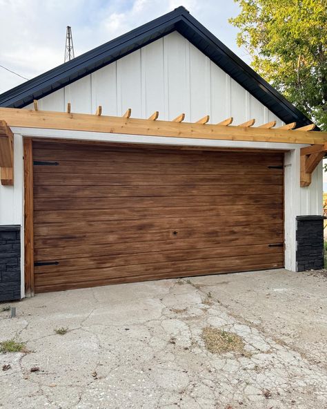 🤌🏻✨ DIY faux wood garage door and I love 😍 painted the garage knob black and added magnetic hinges to finish it off. Next up is new concrete! . . . #garage #exterior #exteriordesign #diy #project #painting #paint #home #homemakeover #garagedoors Diy Wood Garage Door, Old Garage Makeover, Old Garage Door, Door Transformation, Faux Wood Garage Door, Concrete Garage, Wood Garage, Garage Exterior, Wood Garage Doors