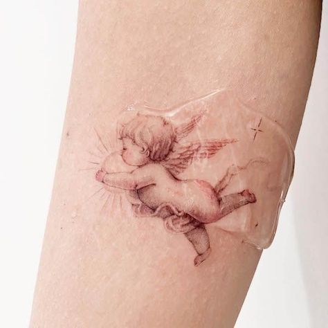 Curly Hair Angel Tattoo, Angel And Flowers Tattoo, Baby Angels Tatoos, Cherub Baby Tattoo, Angel Tattoo Cherub, Angelic Tattoos For Women, Tattoos For Children Ideas, Dainty Angel Tattoo, 2 Sons Tattoo