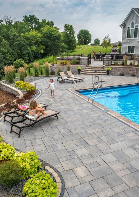 Unilock paver pool deck with coping | Unilock Pool And Patio, Inground Pool Landscaping, Amazing Swimming Pools, Pool Diy, Pool Pavers, Rectangle Pool, Pools Backyard Inground, Swimming Pool Landscaping, Pool Remodel