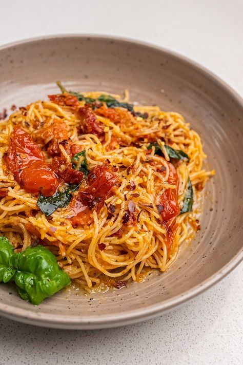 Servings: About 2-3       Ingredients:    300 g Capellini pasta  ¼ cup sun-dried tomatoes, chopped  1 cup cherry tomatoes  1 teaspoon chili flakes  8 garlic cloves, minced  ¼ cup olive oil  2 tbsp. fresh basil  ¼ cup Parmesan cheese  Salt and black pepper     Instructions:    1. Cook the pasta in a Lemon Capellini, Capellini Pasta, Sun Dried Tomatoes, Chili Flakes, More Recipes, Dried Tomatoes, Tasty Food, Parmesan Cheese, Fresh Basil