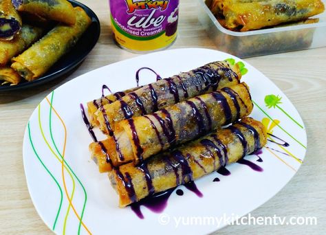 Ube Turon Malagkit (with Costing) - Yummy Kitchen Ube Filipino Desserts, Ube Turon, Ube Cheese Turon, Ube Turon With Cheese, Ube Halaya Recipe Filipino Desserts, Easy Ube Dessert, Ube Turon Malagkit With Cheese, Ube Cheese Turon Malagkit, Ube Biko With Yema Toppings