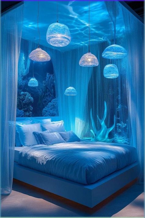 Underwater Oasis uses deep blues and aquamarine hues to create a bedroom that feels like it's beneath the sea. Aquariums or high-quality underwater wall murals can serve as focal points, bringing the tranquility of ocean life into the room. Lighting that mimics water reflections can add to the underwater illusion, creating a captivating and relaxing environment. This design is perfect for anyone fascinated by the ocean depths. Learn how to design your underwater-themed bedroom by clicking or tapping here. Blue Bedroom Ideas Wallpaper, Blue Bedroom Aesthetic Ideas, Led Lights Bedroom Blue, Blue Themed Bedroom Aesthetic, Blue Luxury Bedroom, Chill Bedroom Aesthetic, Light Blue Bedroom Aesthetic, Blue Room Ideas Bedroom, Led Lights Bedroom Ideas Decoration