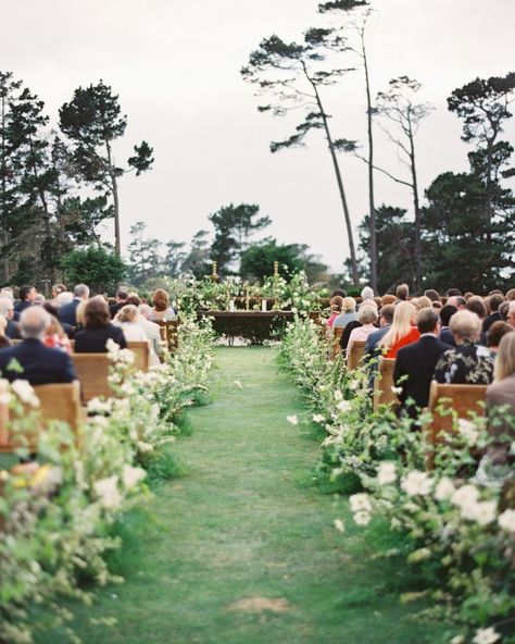 Coastside Couture Wedding at MPCC in Pebble Beach. Floral by Sarah Winward, pews from Archive Rentals Photo by Erich Mcvey Fern Lined Wedding Aisle, Meadow Flowers Wedding Aisle, Meandering Wedding Aisle, Wedding Under Oak Tree Outdoor Ceremony, Live Oak Wedding Ceremony, Processional Wedding Songs, Processional Songs, Greenhouse Venue, Ceremony Design