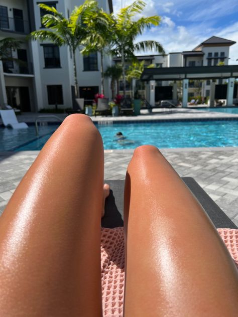 Girl laying out tanning by the pool Tanning Pool, Smooth Legs, Florida Resorts, Tan Legs, Resort Style Pool, Pool Day, Florida Living, 2025 Vision, Summer Ideas