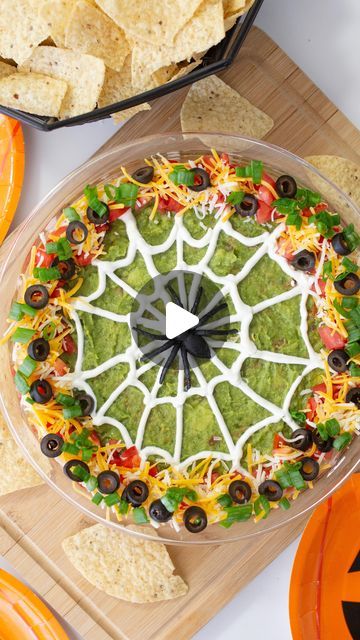 Melissa Johnson on Instagram: "7 layer Taco Dip - this Halloween appetizer was SO good that while I accidentally ate half before the kids got home from school. So many flavors in one pie dish make it so easy to dip those tortilla chips right on in for the perfect Halloween snack! 

Halloween Spider Web 7 Layer Dip

3 16oz cans refried beans
3 cups guacamole 24oz
4 tablespoons taco seasoning
1/2 cup shredded cheese
1/2 cup chopped tomatoes
1/2 cup sliced olives
1/2 cup chopped green onion
1/2 cup sour cream

1. Mix together refried beans and taco seasoning
2. Spread refried beans into a single layer in the bottom of a 9” pie dish. 
3. Spread guacamole into a layer over refried beans.
4. Using a squeeze bottle, piping bag, (or ziplock bag with the corner cut) to make your spider web. Make 16 Halloween 7 Layer Dip, Halloween Guacamole, Spider Web Taco Dip, Halloween Taco Dip, Layer Taco Dip, Snack Halloween, 7 Layer Taco Dip, Halloween Appetizer, Layered Bean Dip