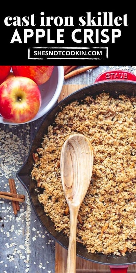 Apple crisp in cast iron skillet with wooden spoon. Apple in a white bowl. Iron Skillet Apple Crisp, Apple Crisp Recipe With Oats, Skillet Apple Crisp, Recipe With Oats, Skillet Desserts, Baked Apple Dessert, Oatmeal Toppings, Apple Desserts Easy, Apple Crisp Recipe