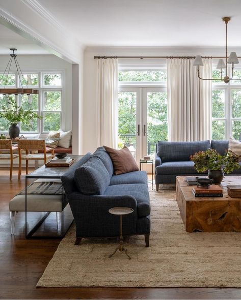 Living room with two deep blue sofas. A big area rug underneath a wooden coffee table. Wall of windows. Family Friendly Living Room, Textured Rug, Nancy Meyers, Cozy Living Spaces, Blue Sofa, Spacious Living, Spacious Living Room, Living Room Inspo, Cozy Living Rooms