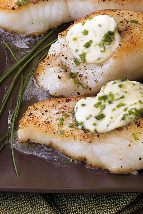 Pan-roasted Sea Bass with Garlic Butter (serves 4):  For perfectly cooked fish, sear it on the stove top until it has a nice golden crust, then finish cooking it in the oven for a fillet that stays moist and flaky. This same technique works well with all types of fish. In this recipe, the sea bass is topped with a flavorful butter to create an instant sauce.   These flaky pan-roasted sea bass fillets topped with chive garlic compound butter will impress your dinner guests every time. Sea Bass Fillet Recipes, Garlic Compound Butter, Sea Bass Recipes, Fish Fillets, Compound Butter, Fish Dinner, Two Fish, Seafood Dinner, Cast Iron Cooking