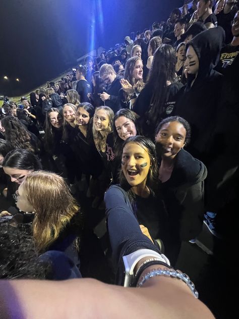 Teenagee girls take a .5 at a black out themed high school football game while it is raining Black Out Fnl Theme, Black Out Game Football, Black Out Outfits For Football Games, Black Out Fnl, Black Out Football Game Outfits, Blackout Football Game, Black Out Football Game, Highschool Vibes, Football Game Outfit Fall