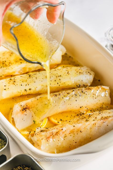 Baked cod infused with lemony garlic butter is the perfect entrèe when you're craving a healthy & light meal! We love these oven-baked cod fillets, served on a layer of fresh lemon slices! #bakedcod #spendwithpennies #bakedcod #recipe Baked White Fish Recipes Healthy, Garlic Butter Baked Cod, Cod Recipes Oven, Butter Baked Cod, Cod Fish Recipes Baked, Baked Cod Fillets, Cod Recipes Healthy, Cod Fillet Recipes, Oven Baked Cod