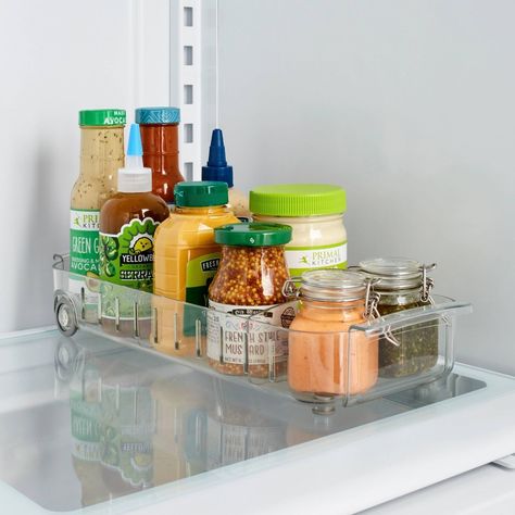 A roll-out caddy to give your condiments a fun little ride in and out of the fridge. Camper Refrigerator, Lazy Susan Organization, Rotating Spice Rack, Freezer Organization, Fridge Organisers, Fridge Storage, Lid Organizer, Refrigerator Organization, Fridge Organization