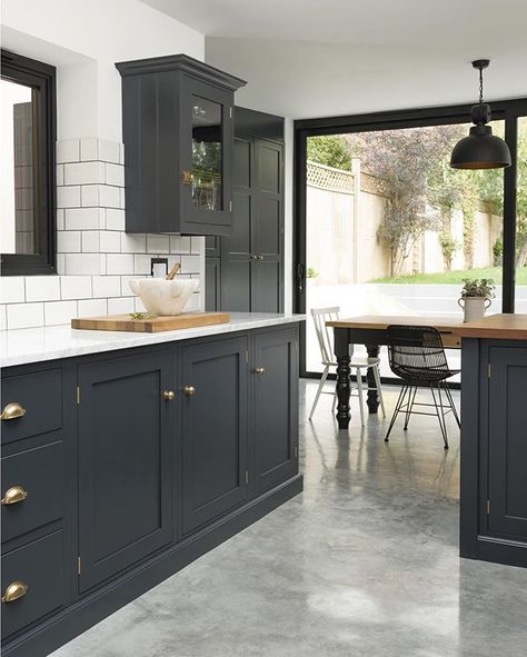 White metro tiles, lots of marble and an amazing polished concrete floor; this is a super stylish Shaker kitchen which works perfectly in this newly renovated Victorian property, where the owners have created a haven of cool tranquillity at the back of their house #deVOLKitchens Dark Grey Kitchen Cabinets, Dark Grey Kitchen, Devol Kitchens, Painted Kitchen Cabinets Colors, London Kitchen, Shaker Style Kitchens, Concrete Kitchen, Blue Cabinets, Grey Kitchen Cabinets