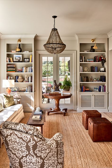 This living room and library features custom built-in cabinets with gorgeous sconces and interesting lighting. #livingroom #countrystyle #countrydecor #farmhousestyle #library Country Farmhouse Living Room, Living Room Library, Home Library Rooms, Living Room Built Ins, Room Library, Home Library Design, Design Salon, Farmhouse Living Room, Home Libraries