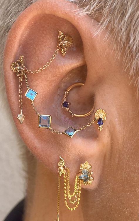 Ear Piercings Vintage, Curated Ear Piercing Maximalist, Tons Of Ear Piercings, Ear Piercing Ideas Colorful, Stacked Piercing Ideas, Gold Earring Set Up, Cute Daith Jewelry, Daith Piercing Inspiration, Ear Curation Daith