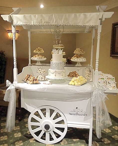 A stunning setup with delicious baked goods for a baby shower Wedding Sweet Cart, Wedding Candy Cart, Sweet Cart, Sweet Carts, Idee Babyshower, Candy Station, Wedding Sweets, Candy Cart, Student Christmas Gifts