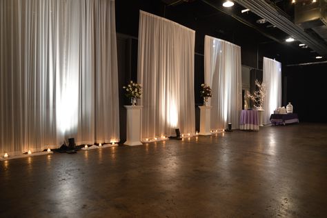 Outer walls highlighted with illuminated draping panels around the room. Watch as we go from white for the ceremony and change color for the reception. ~Draping by Events Plus Nashville. #Wedding #reception #draping #Venue #transformation #decorations #lighting Banquet Hall Wedding Decor Draping, White Curtains Wedding Draping, White Draped Walls Wedding, Chiffon Wall Draping, Wedding Wall Drapery Ideas, Wall Drapping Ideas, Drape Walls For Party, Draping Walls For Wedding, Party Drapery Ideas