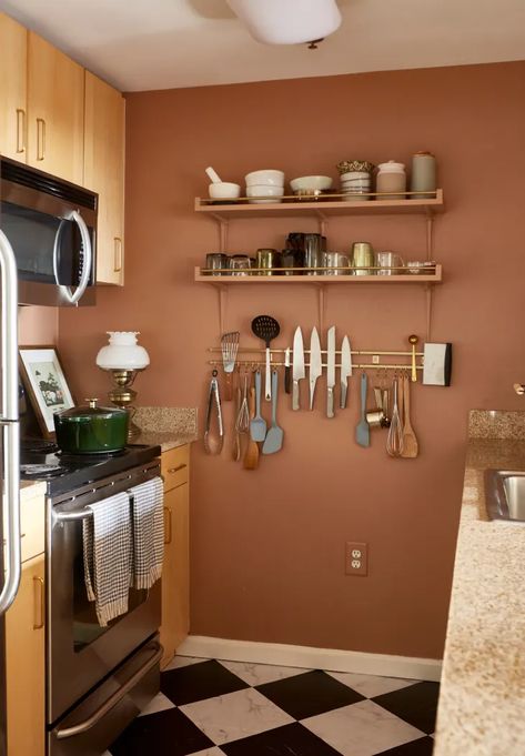 This Decorating Trend Can Dress Up Your Kitchen Instantly | Apartment Therapy Fun Kitchen Wall Colors, White Kitchen Cabinets Terra Cotta Floor, Terracotta Paint Color Kitchen, Rust Color Kitchen Walls, Terra Cotta Kitchen Decor, Apricot Kitchen Walls, Same Color Walls And Cabinets, Cool Kitchen Colors, Terra Cotta Colored Walls