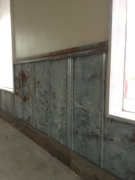 Acid washed metal wainscot being installed Metal Trim Wall, Industrial Wainscoting Ideas, Metal Wainscoting Ideas, Interior Metal Walls, Steel Accent Wall, Metal Wall Paneling, Metal Wainscoting, 1890 House, Metal Accent Wall