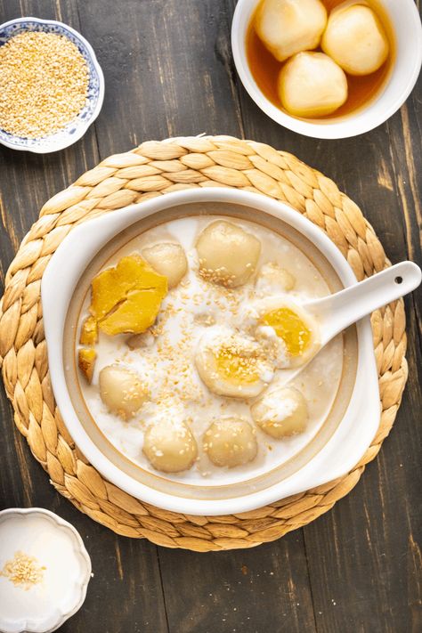 When you're craving something sweet, these Vietnamese Glutinous Rice Balls with Ginger Syrup will hit the spot! They're bite-sized parcels of love, perfect for family celebrations or those special in your life. #glutinousriceballs #gingersyrup #mungbeanpaste #tet #vietnamesenewyear #vietnamesefood #asiandessert Glutinous Rice Balls Recipe, Tet Food, Vietnamese Sweets, Rice Ball Recipe, Asian Baking, Glutinous Rice Balls, Vietnamese Desserts, Vietnamese Rice, Vietnamese Dessert