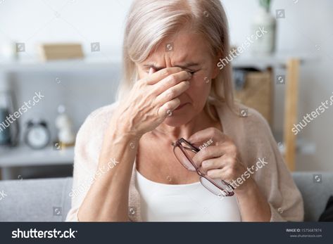 Elderly woman crying wipes tears with hands feels unhappy, bad news. Middle-aged woman taking off glasses closed eyes rubbing eyelid suffers from eye strain deterioration eyesight with age concept #Ad , #AD, #bad#unhappy#feels#aged Rubbing Eyes Reference, Middle Aged Woman, Elderly Woman, Closed Eyes, Behavioral Health, Eye Strain, Bad News, Health Issues, Pose Reference