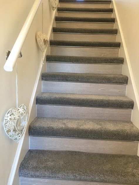 Grey laminate kick boards with grey carpet. Each step lined with a chrome edging. Carpeted Treads Only, Painted Stairs With Carpet Treads, Laminate Wood Flooring With Carpet Stairs, Stairs With Carpet And Laminate, Stair Carpet Ideas Grey, Stairs With Carpet And Wood, Carpet And Laminate Stairs, Grey Carpet Stairs, Led Stair Lights Carpet