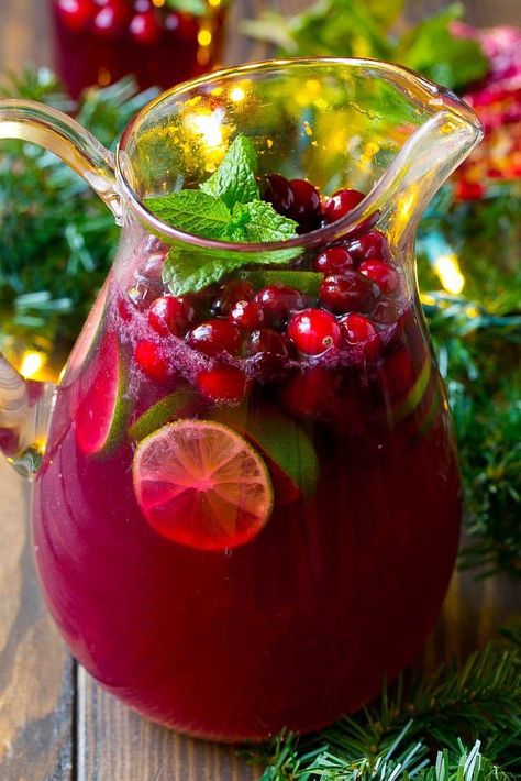 This Christmas punch is a blend of pomegranate, lime and cranberry, all mixed together into a fizzy beverage that’s perfect for any holiday party. Holiday Punch Recipe, Christmas Drinks Alcohol Recipes, Christmas Party Drinks, Christmas Drinks Alcohol, Christmas Punch Recipes, Holiday Punch, Christmas Punch, Holiday Drink, Seasonal Drinks