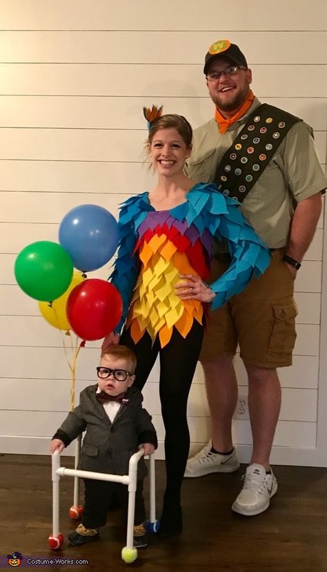 Our son is being Carl. I am Kevin, I handmade my costume with felt! Cut out the feathers and used hot glue! My husband is Russel, I made his sash and badges. The badges are felt circles with the badges glued (paper printed). UP is... Family Costumes Disney, Disfraz Up, Russell Up Costume, Russell Costume, Disney Family Costumes, Disney Couple Costumes, Family Themed Halloween Costumes, Disney Costumes Diy