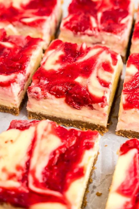 Satisfy your sweet tooth with these simple and tasty strawberry cheesecake bars. Made with fresh strawberries, cream cheese, and a buttery graham cracker crust, this recipe is sure to become a family favorite! Triple Berry Cheesecake Bars, Cheesecake Bars Strawberry, Strawberry Cheesecake Bars Easy, Easy Frozen Strawberry Desserts, Strawberry Chess Squares, Strawberry Cream Cheese Recipes, Jello Cheesecake Recipes, Strawberry Cream Cheese Bars, Sweetened Condensed Milk Desserts