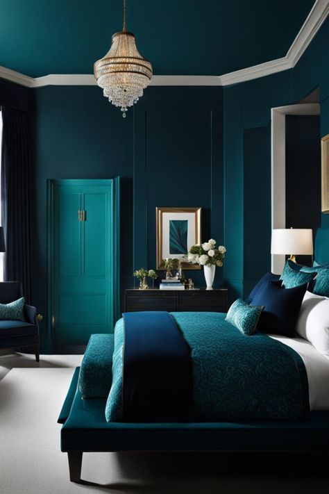 Envision a room in a dark teal, with a black wood bed frame and a velvet bench in navy blue at the foot. Light wood flooring and a cream area rug contrast the walls, with a gold-framed mirror adding sophistication. Teal Room Color Scheme, Blue Monochromatic Bedroom, Navy And Emerald Bedroom, Cyan Bedroom, Teal Headboard Bedroom, Deep Teal Bedroom, Teal Room Ideas, Navy And Teal Bedroom, Teal Bedroom Color Schemes