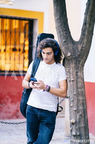 Young man using mobile phone while carrying guitar bag, Santa Cruz, Seville, Spain, Europe #AD , #phone, #carrying, #guitar, #Young, #man Guitar Bag, Seville Spain, Art Fonts, Seville, Carry On, Mobile Phone, Spain, Guitar, Quick Saves