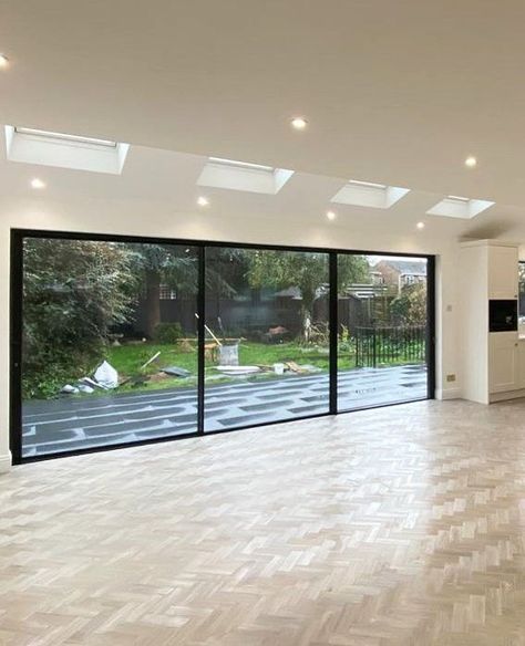 Our 20mm sliding doors truly are a stunning addition to any home.⁠✨️⁠
⁠
These doors were designed and installed for a luxurious home in London. The bold black aluminium frames are striking against the bright neutral interiors, adding to the contemporary look of the extension.⁠
⁠
Our doors give a full view onto the patio, effortlessly sliding open to flow onto the patio, with the slim frames and wide panels of glass bringing in an abundance of light.⁠☀️⁠ Glass Doors Interior Living Rooms, Oak Herringbone Floor, Exterior Sliding Glass Doors, Aluminium Glass Door, Frameless Sliding Doors, Sliding Doors Exterior, Sliding Glass Doors Patio, Glass Doors Patio, Aluminium Sliding Doors