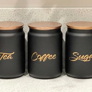 Black Kitchen Storage, Gold Kitchen Accessories, Tea Coffee Sugar Canisters, Black Kitchen Decor, Kitchen Storage Canisters, Ring Security, Idee Cricut, Sugar Canister, Gold Kitchen