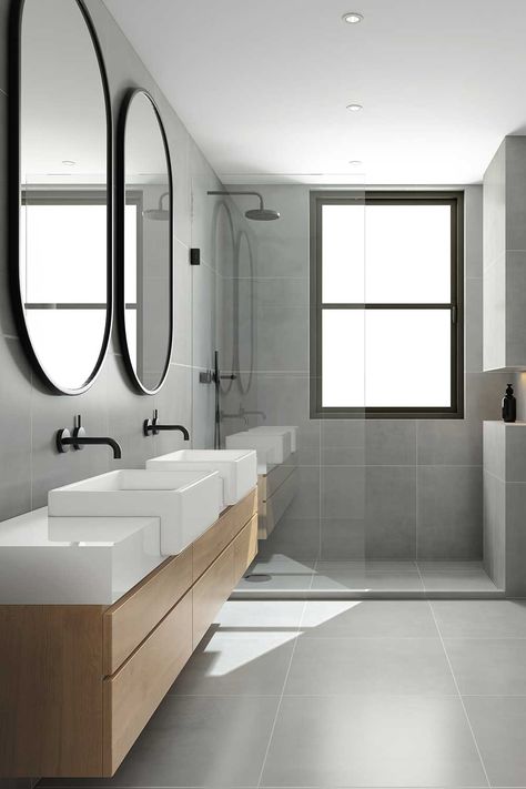 Minimalism is a major feature of modern decor. Modern features include the dark gray tile, black fixtures, oak and white colored vanity and sink. Dark Grey Tile Bathroom, Professional Bathroom, Light Grey Bathrooms, Dark Gray Bathroom, Ceiling Exhaust Fan, Gray And White Bathroom, Grey Bathroom Tiles, Oak Bathroom, Retro Revival