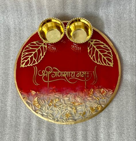 A beautiful resin puja thali for Raksha Bandhan and Ganesh Chaturthi Rakhi Thali Resin, Resin Pooja Plate, Resin Art Pooja Thali, Resin Thali Ideas, Resin Plates Ideas, Resin Puja Thali, Resin Pooja Thali Ideas, Raksha Bandhan Thali Decoration, Puja Thali Decoration Ideas