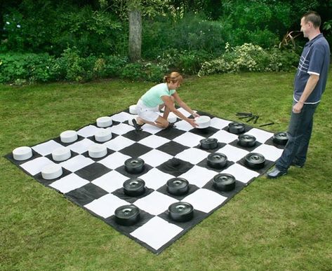 An oversized version of the popular, age old game, Giant Garden Draughts or Checkers is perfect for summer parties, BBQ's, pub gardens or any outdoor function. Suitable for all ages, this board game will give hours of fun as you try and outwit your opponent by taking all their pieces whilst ultimately trying to get yours crowned.    The giant pieces are made from durable waterproof and UV protected PVC.        24 x Draughtsman - 25cm D x 9cm H ( 12 black, 12 white)      1 x Giant playing mat - 3 Giant Yard Games, Giant Checkers, Giant Chess, Tower Games, Checkers Game, Yard Party, Diy Lawn, Giant Games, Garden Games