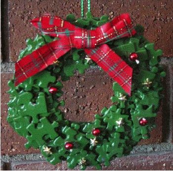 puzzle wreath                                                                                                                                                                                 More Puzzle Pieces Christmas Ornaments, Jigsaw Puzzles Crafts, Christmas Ornaments Made Out Of Puzzle Pieces, Puzzle Wreath Craft, Puzzle Piece Wreath Ornament, Puzzle Piece Christmas Tree, Puzzle Piece Wreath, Jigsaw Crafts Ideas, Jigsaw Pieces Craft Ideas