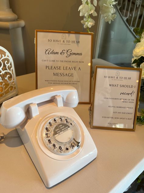 A white rotary telephone used as an audio guestbook at a wedding with two photo frames with instructions on how to use the guestbook. Voice Mail Wedding Guest Book, Telephone Wedding Guest Book, Audio Guest Book Table, No Phones Wedding, Wedding Telephone, Wedding Seating Chart Display, Wedding Phone, Wedding Guest Book Table, Gift Table Wedding