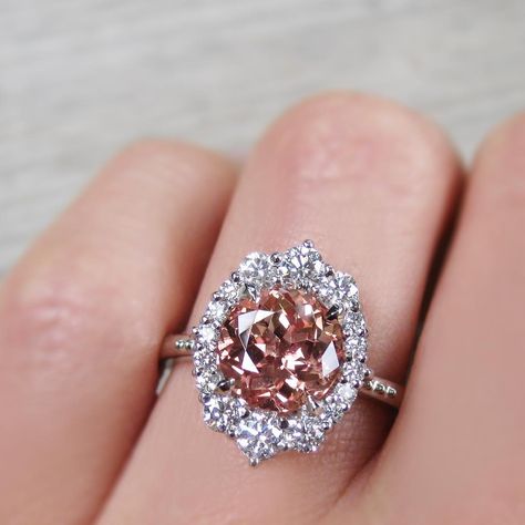 LOVE the peach color, although I prefer a step cut! Most Expensive Engagement Ring, Kristin Coffin Jewelry, Peach Champagne Sapphire, Coffin Jewelry, Champagne Sapphire, Sapphire Engagement Ring Halo, Morganite Jewelry, Halo 3, Peach Sapphire