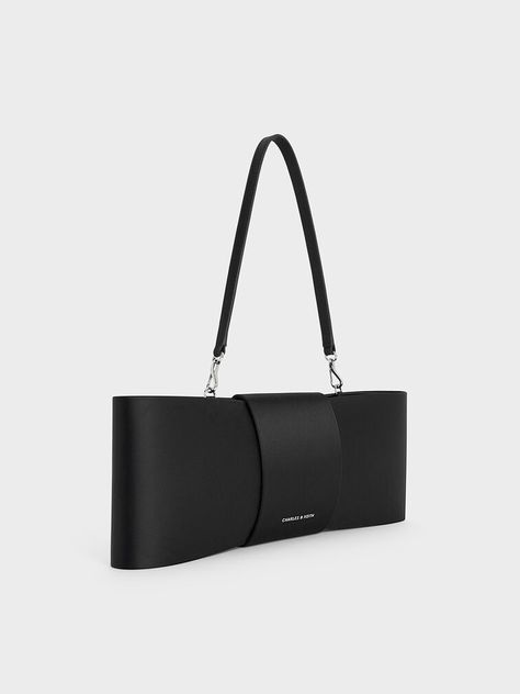 Replace your trusty little black bag with this satin shoulder bag. With an over-sized bow making up its entire front, it is an understated yet distinctive piece that will stand out anywhere. In black, it will match well with most ensembles and give them character. Bow Making, Charles Keith, Satin Bow, Black Bag, How To Make Bows, Satin, Shoulder Bag, Handbags, Black