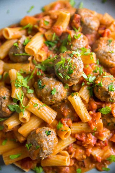 Rigatoni and meatballs are nestled in a flavorful vodka cream sauce! This homestyle meal has old-world charm but made with modern flair! Meatballs And Vodka Sauce, Vodka Sauce Pasta With Meatballs, Vodka Sauce Pasta With Ground Beef, Recipes With Vodka Sauce, Penne And Meatballs, Rigatoni And Meatballs, Rigatoni With Vodka Sauce, Recipes With Vodka, Vodka Cream Sauce