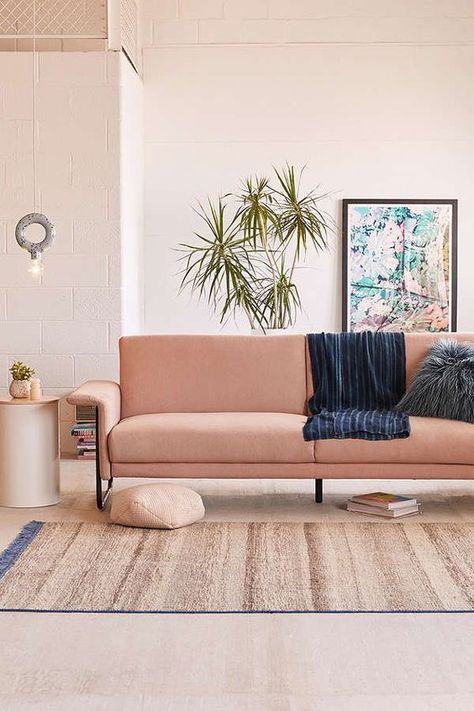 a cozy warm colored living room with a salmon colored sofa and potted greenery feels like summer Couches For Small Spaces, Furnitur Ruang Keluarga, Sofas For Small Spaces, Coastal Living Rooms, Affordable Decor, Types Of Sofas, Sofa Living, Affordable Furniture, A Living Room