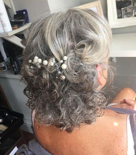 Formal Curly Half-Updo For Salt-And-Pepper Hair Formal Hairstyles Grey Hair, Gray Hair Wedding Hairstyles, Mother Of The Bride Hair Curly, Grey Hair Updos, Mother Of The Bride Hair Half Up, Semi Formal Hairstyles, Curly Hair Up, Pepper Hair, Gray Hair Styles