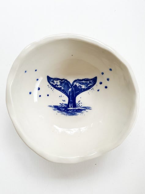 White ceramic bowl with a blue whale tail Dolphin Pottery Painting, Sea Life Pottery Painting, Mermaid Pottery Painting, Sea Themed Pottery Painting, Whale Pottery Painting, Ceramic Painting Animals, Beachy Pottery Painting Ideas, Ceramic Ocean Theme, Ocean Themed Pottery Painting