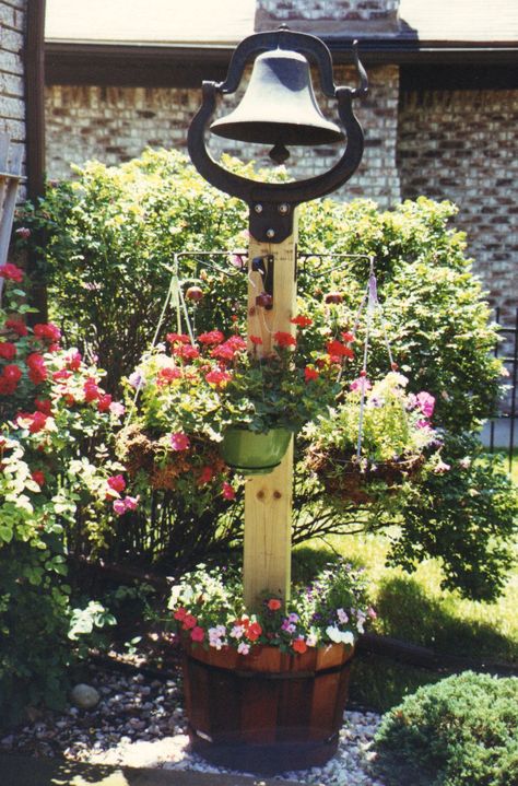 Vintage Farm Bell. In 1858, the C.S. Bell family cast their first farm bells, school bells and church bells in Hillsboro, Ohio, and started an American tradition. Dinner Bell Post, Front Porch Landscape, Cast Iron Bell, House Garden Landscape, Bell Gardens, Antique Bell, Driveway Landscaping, Magic Garden, Dinner Bell