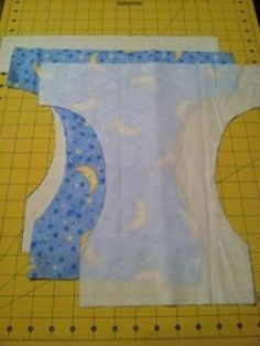 Cut out all three layers. Diy Cloth Diapers, Diaper Cover Pattern, Projek Menjahit, Reusable Diapers, Cloth Nappies, Baby Sewing Projects, Cloth Pads, Baby Sewing Patterns, Dog Diapers