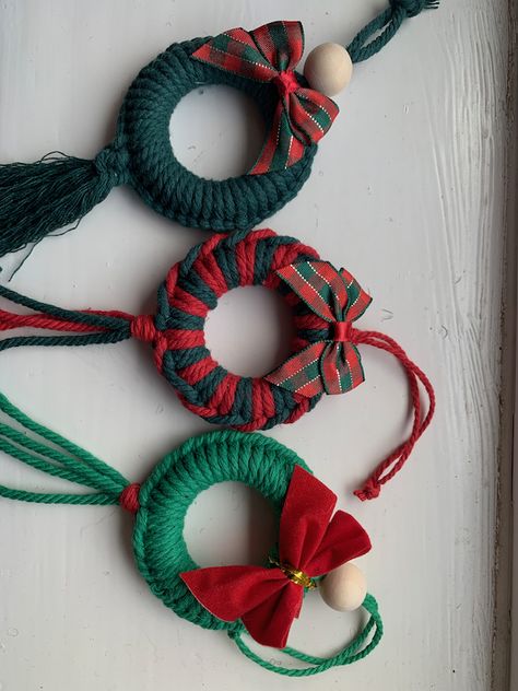 Beautiful Macrame Christmas Wreath Tree Decorations.  These are carefully made using high quality cotton cords and a wooden ring/bead.  Each wreath can be made in a variety of colour combinations, simply choose your design number (photo 2) and your desired colour from the drop down menus at the checkout :)I am always happy to make in any colour so just drop me a message if this is your preference e.g. red and white.The completed decoration measures approximately 6cm in diameter with the tassels/ Macrame Christmas Presents, Christmas Yarn Crafts Decoration, Macrame For Christmas, Bead Christmas Decorations, Macrame Christmas Ornaments Diy, Christmas Handmade Decorations, Macrame Christmas Decorations, Macrame Christmas Wreath, Christmas Yarn Crafts