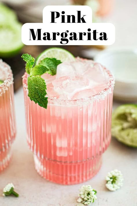 Pink margarita in a glass with a salted rim and mint for garnish. Pink Margarita Recipe, Cadillac Margarita Recipe, Galentines Cocktails, Cadillac Margarita, Pink Margarita, Easy Margarita Recipe, Pitcher Cocktails, Easy Margarita, Cocktail Pitcher